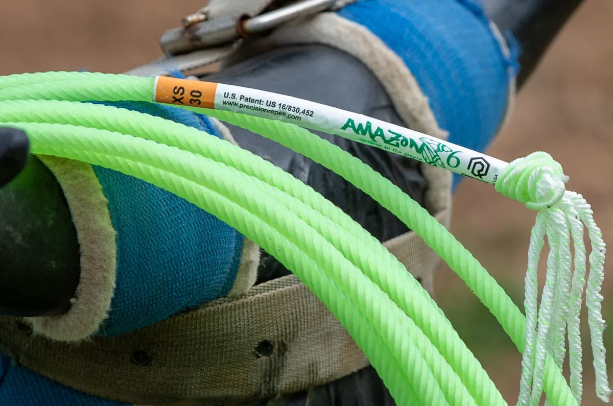 Neon green Amazon 6 rope with its label, coiled on a saddle