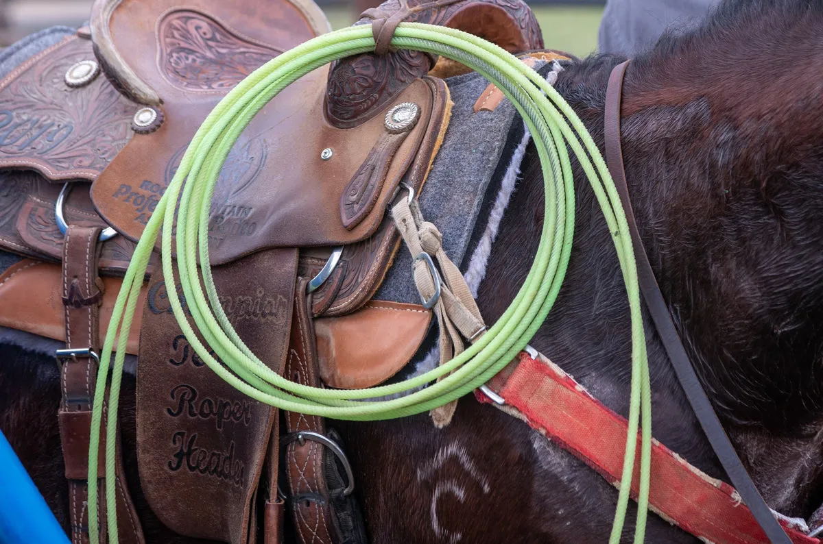 Neon green Amazon 6 rope hanging from a saddle horn